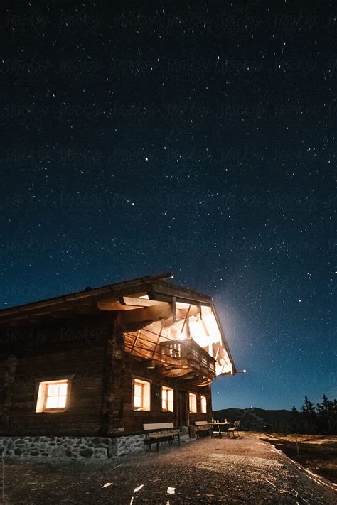 "Wooden Alpine Cabin Under Starry Night Sky" by Stocksy Contributor ...