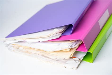 File Folder Binder stack of multi color on table in office. 2666294 ...