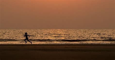 Silhouette of Person Running on the Beach during Sunset · Free Stock Photo