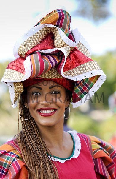 Woman wearing Jamaican national costume for cultural display at ...