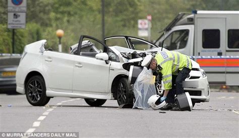 Prince Harry's police motorbike outrider crashes head-on into mini-cab ...