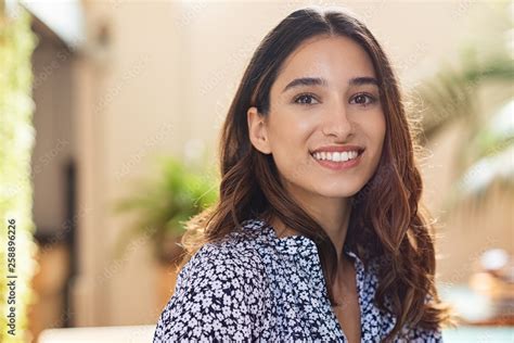 Happy young woman smiling Stock Photo | Adobe Stock