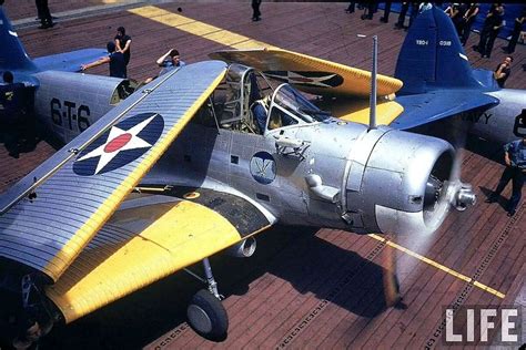 A Douglas TBD Devastator torpedo bomber being readied for launch on USS ...