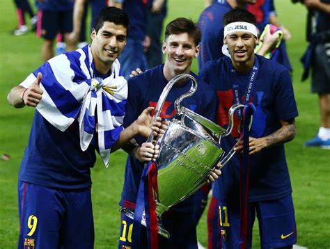 Suarez, Messi and Neymar holding the UEFA Champions League trophy in ...