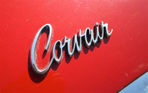 the word corvin is shown on an old red car