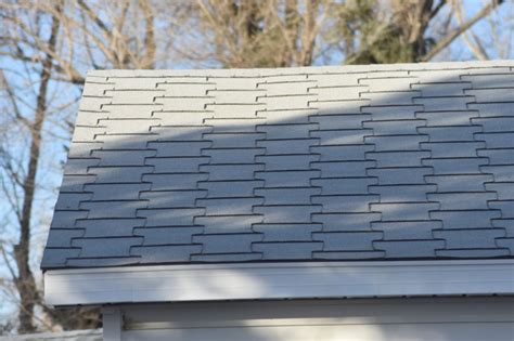 the roof of a house with a bird perched on it