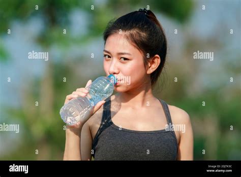 Portrait Of Boy Drinking Water From Bottle Stock Photo - Alamy