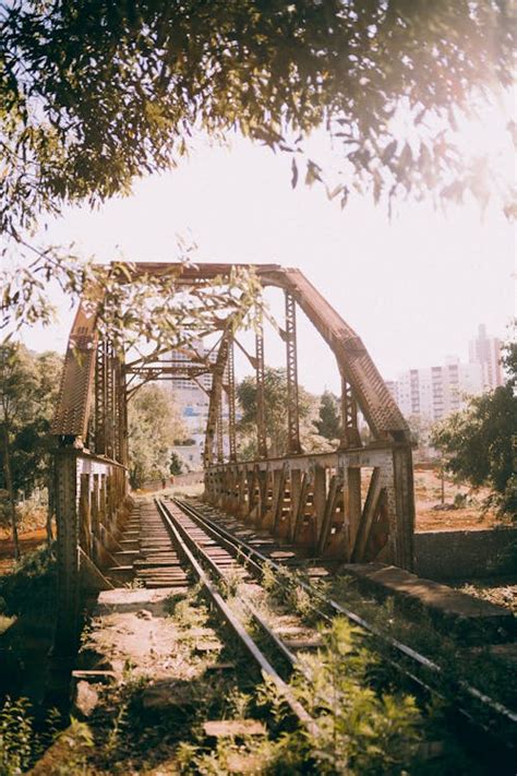 An old train bridge with a train on it · Free Stock Photo