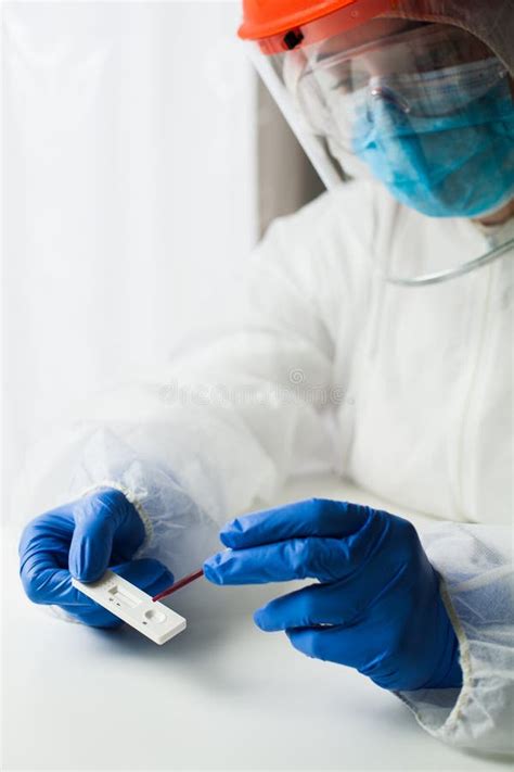 Medical Worker Performing Serology Testing in Laboratory Wearing ...