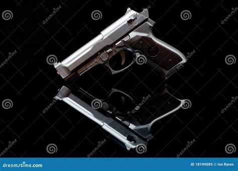 Gun in a mirror stock image. Image of darkened, little - 18199085