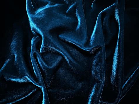 Blue velvet fabric texture used as background. Empty blue fabric ...