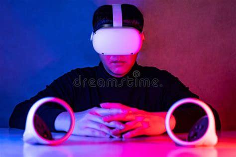 Asian Gamer Wearing VR Headset. Metaverse Concept Stock Image - Image ...