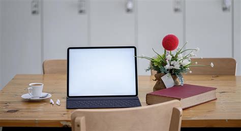 Laptop mockup on a dining room table 1309938 Stock Photo at Vecteezy