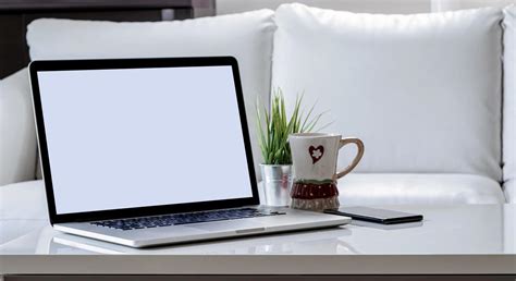 Laptop On Table Stock Photos, Images and Backgrounds for Free Download