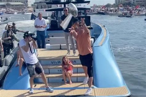 Watch: Tom Brady throws Super Bowl trophy at boat parade party ...