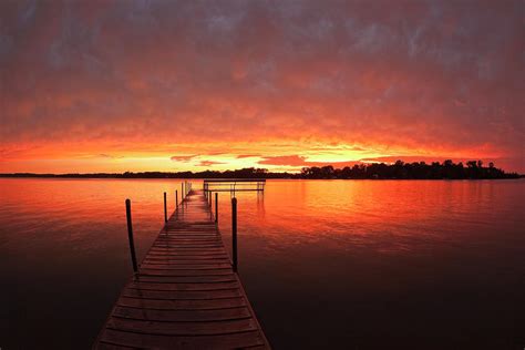 Dock At Sunset On Lake Minnetonka,mn by Alvis Upitis