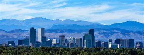 Denver Colorado Skyline Against the Rockies - JL Denver