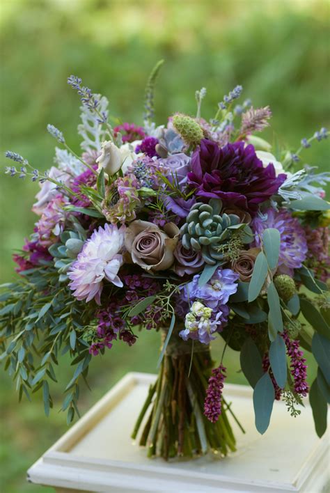 Plum and lavender bridal bouquet featuring dahlias, roses, succulents ...