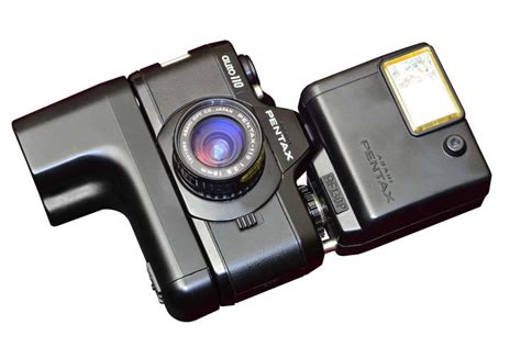 The original Pentax Auto110, with winder and flash. The limitation was ...