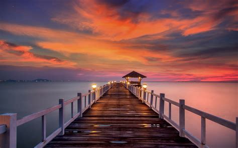 Download Orange (Color) Cloud Sky Sunset Ocean Man Made Pier HD Wallpaper