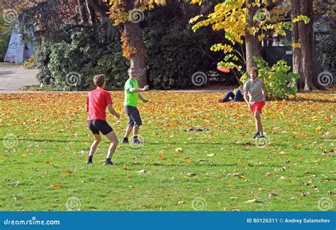 People are Playing Frisbee in City Park Editorial Photo - Image of ...