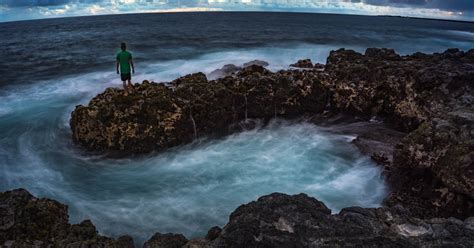 View a Sunset at Kauai's Glass Beach, Hawaii