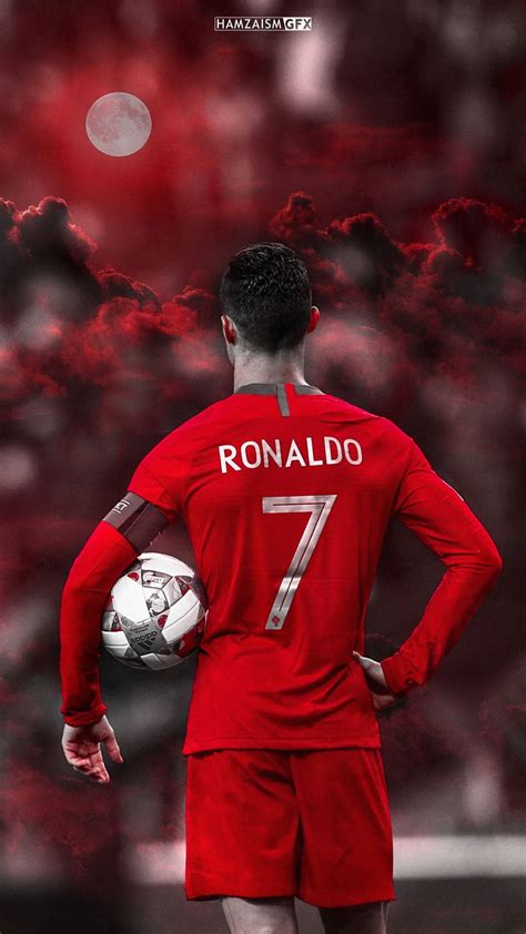 Download Cristiano Ronaldo Portugal Holding Ball Wallpaper | Wallpapers.com