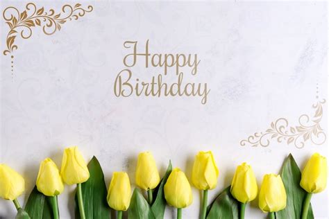 Happy birthday yellow tulip flowers on stone background, flat lay with ...