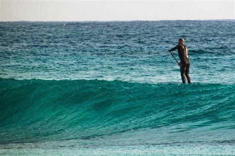 SUP Surfing 101: How To Start Paddle Board Surfing?