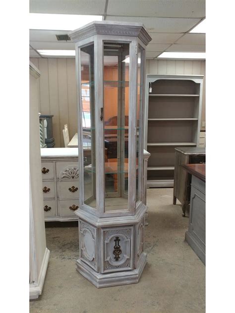 I just love these curio cabinets. They fit into all kinds of spaces and ...