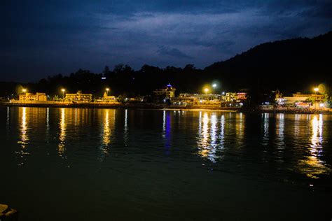 Night view of buildings near a lake - PixaHive