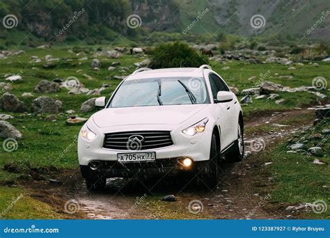 White Infiniti FX30d Turbo Diesel SUV Car on Off Road in Spring ...