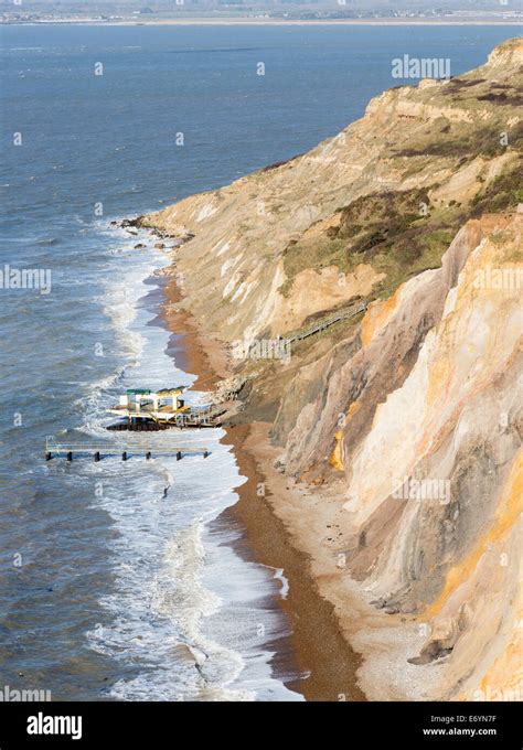 The multi-coloured Eocene sand cliffs of Alum Bay, Isle of Wight, from ...