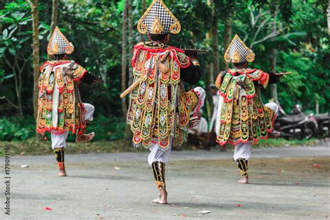 Men in traditional costumes perform a Balinese war dance called Tari ...