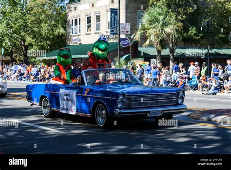 Albert and Alberta, the UF Gators mascots riding with children in the ...