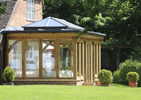 A stunning traditional orangery featuring a glazed lantern and surround ...