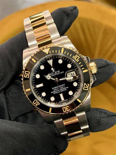 ROLEX SUBMARINER STAINLESS STEEL AND 18CT YELLOW GOLD 116613LN - Carr ...