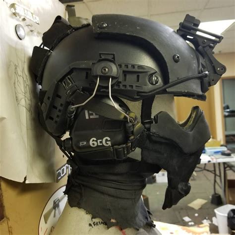 the helmet and goggles are attached to the mannequin's headdress