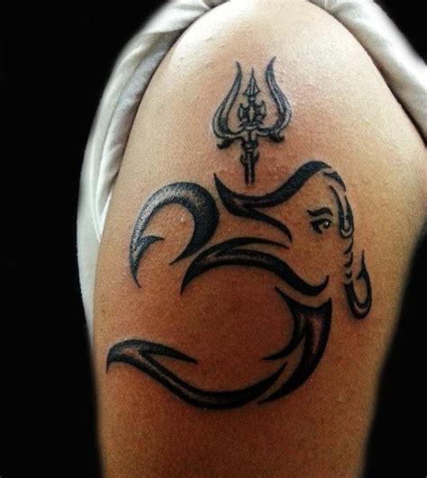 Om and Hindu God Ganapati Tattoo. So cool how they worked the symbol ...