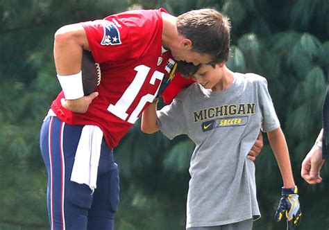 Tom Brady says 15-year-old son Jack has started to borrow his clothes