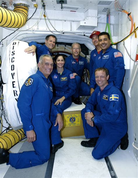 Space in Images - 2009 - 08 - STS-128 crew with Space Shuttle Discovery ...