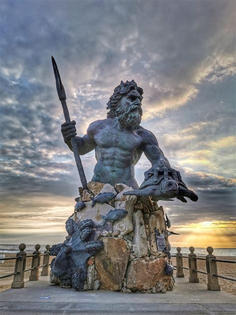 King Neptune statue on Virginia Beach at sunrise - Goat Roti Chronicles