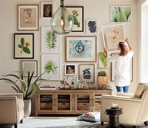 Gorgeous gallery wall of mixed size prints over media console | Gallery ...