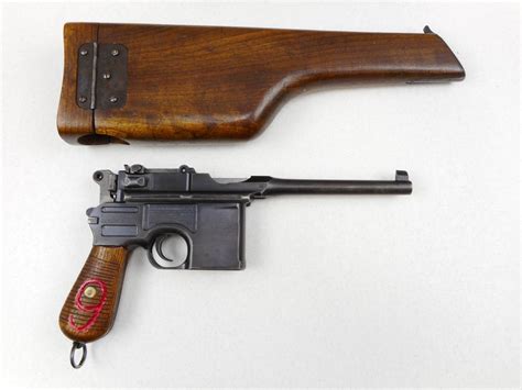 MAUSER , MODEL: C96 BROOMHANDLE RED 9 DATED1920 , CALIBER: 9MM LUGER