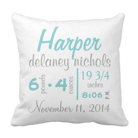 a white pillow with blue lettering on it that says, harper delaney nicholas