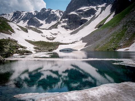 A Snow Covered Mountain Near the Lake · Free Stock Photo