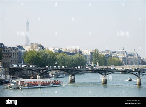 Tourist boat bridge and the eiffel tower in Paris France Stock Photo ...