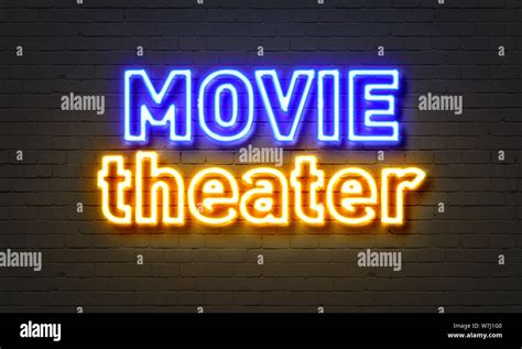 Movie theater neon sign on brick wall background Stock Photo - Alamy