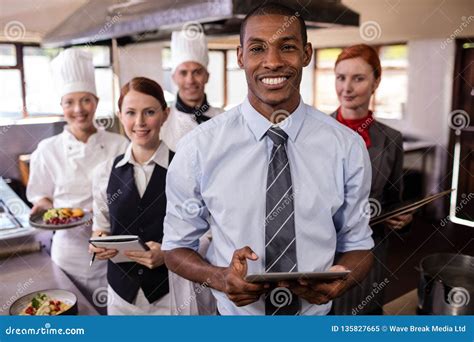 Group of Hotel Staffs Working in Kitchen Stock Image - Image of ...