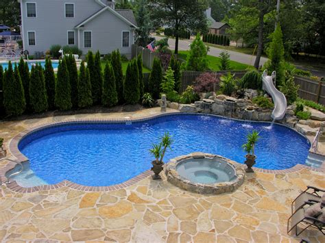 Swimming pool designs with slides | Hawk Haven